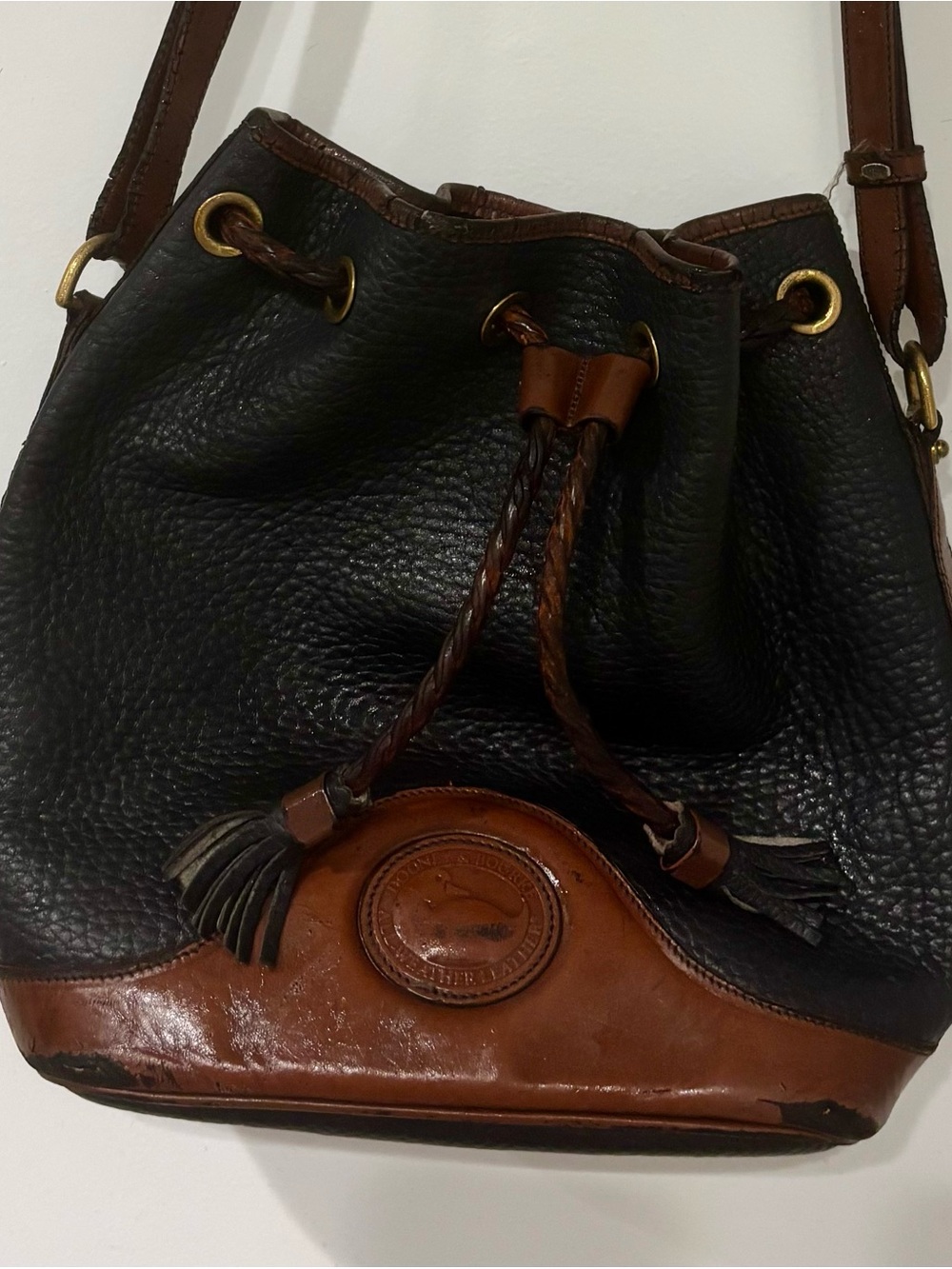 Dooney & Bourke Black and Brown Pebbled Leather Drawstring Hobo